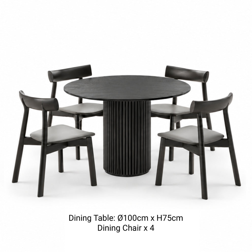 RONAN 100cm black round fluted dining table with four IRIGUCHI wooden dining chairs with grey padded seats.