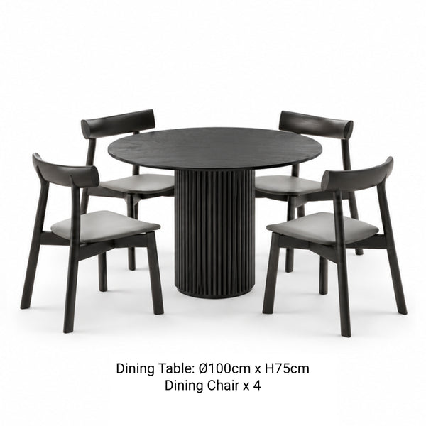 RONAN 100cm black round fluted dining table with four IRIGUCHI wooden dining chairs with grey padded seats.