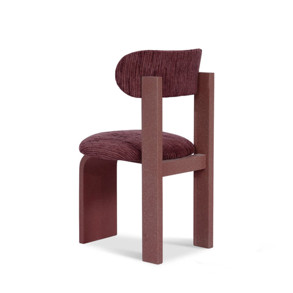 Minimalist red dining chair with sculptural silhouette