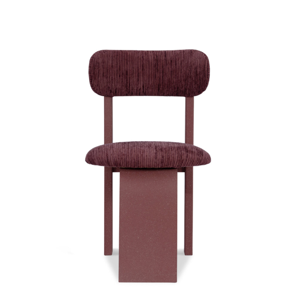Arco dining chair in deep red velvet with sculptural curved back