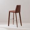 Brown saddle leather bar stool with stainless steel footrest sleek back support