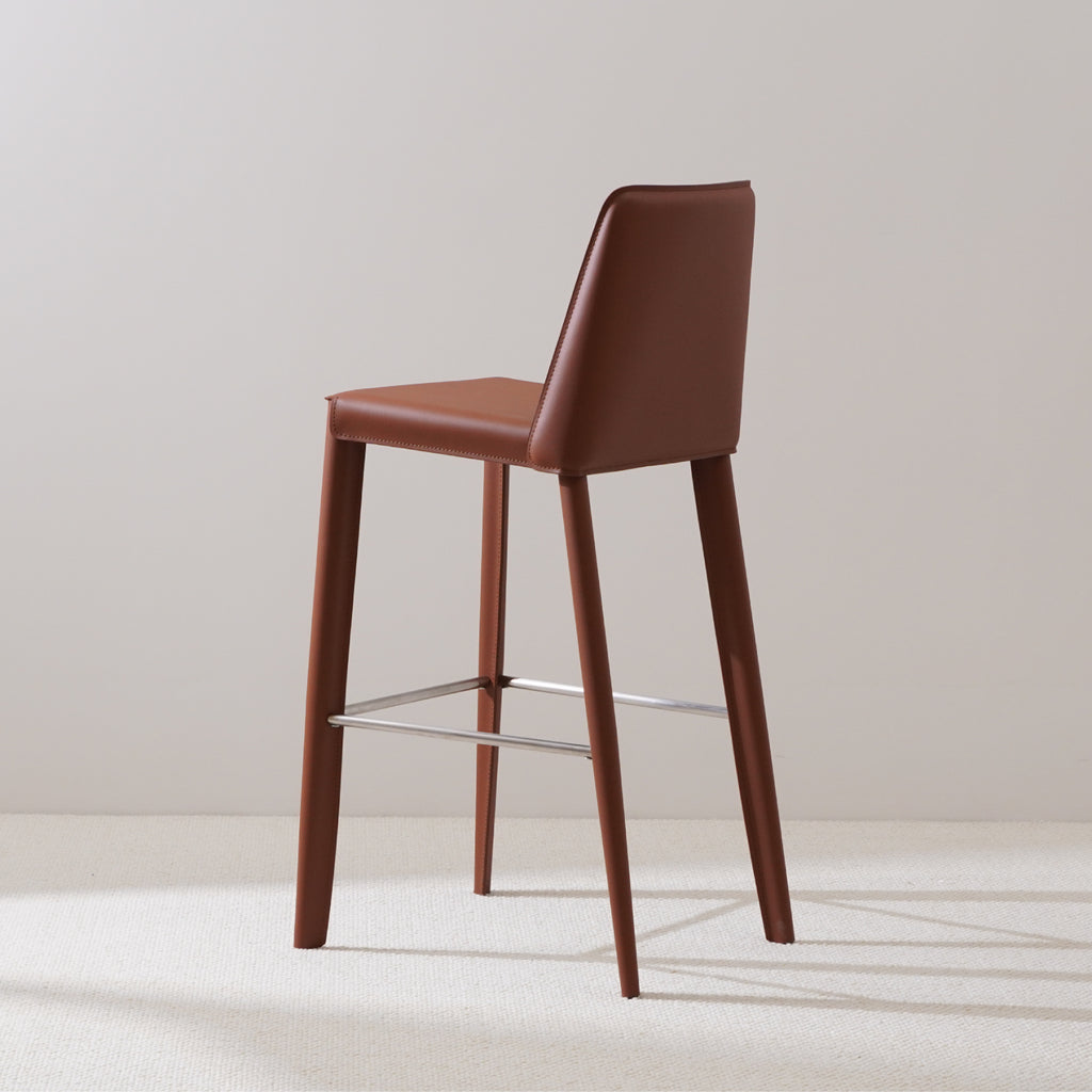 Brown saddle leather bar stool with stainless steel footrest sleek back support