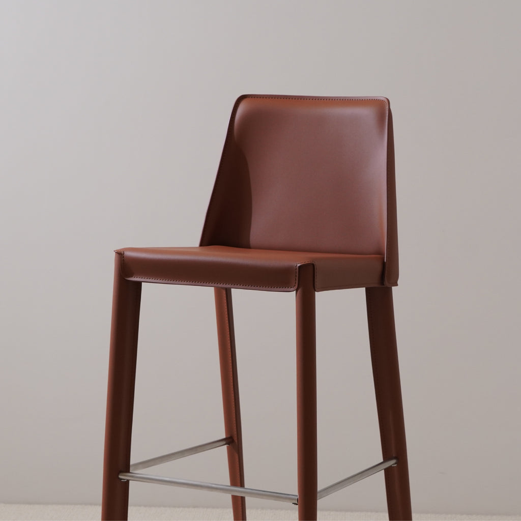 Brown saddle leather bar stool upholstered with stitch detail