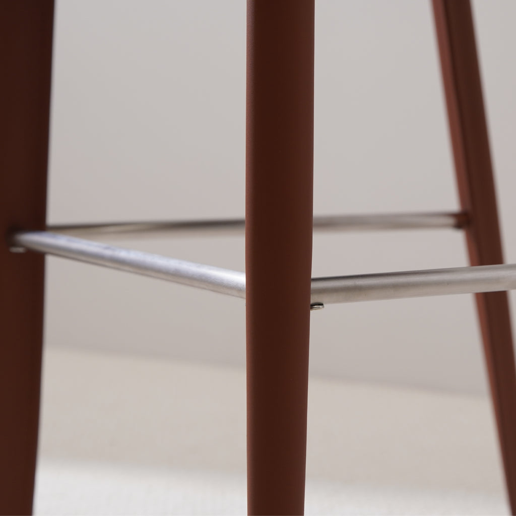 Brown saddle leather bar stool with sleek and contemporary stainless steel footrest