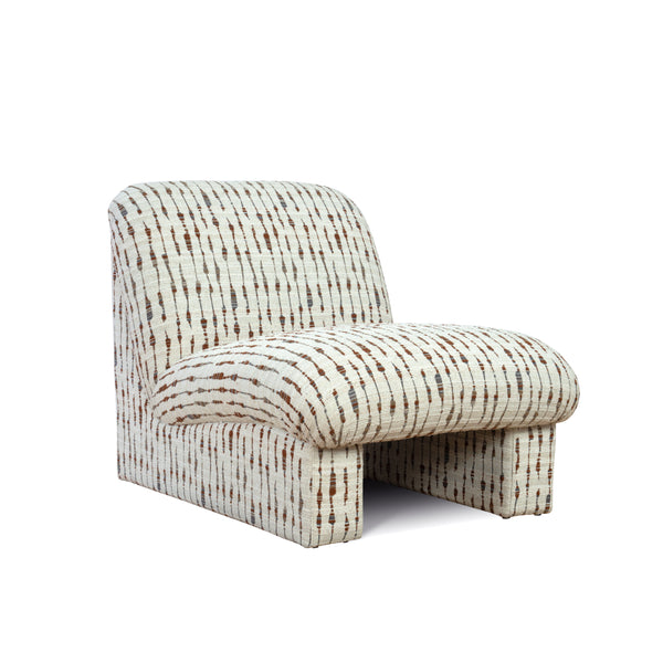 Designer lounge chair styled in neutral textured chenille fabric low seat padded cushioned