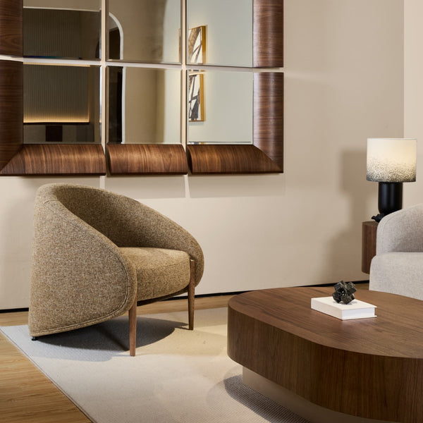 Side view of red oak wooden CEDAR lounge chair with curved design and fully upholstered in high-quality fabric