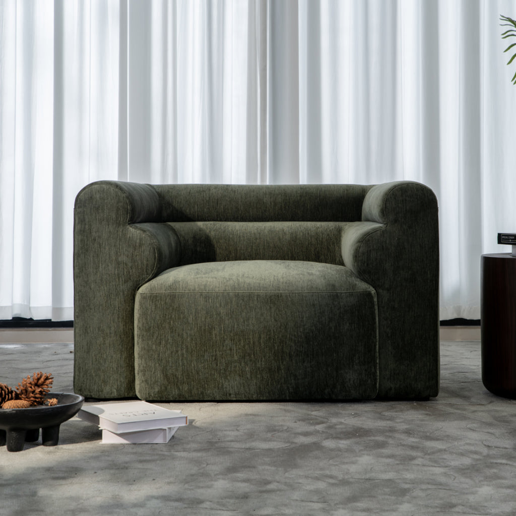 Deep-seating high-density foam single-seater sofa in premium fabric.