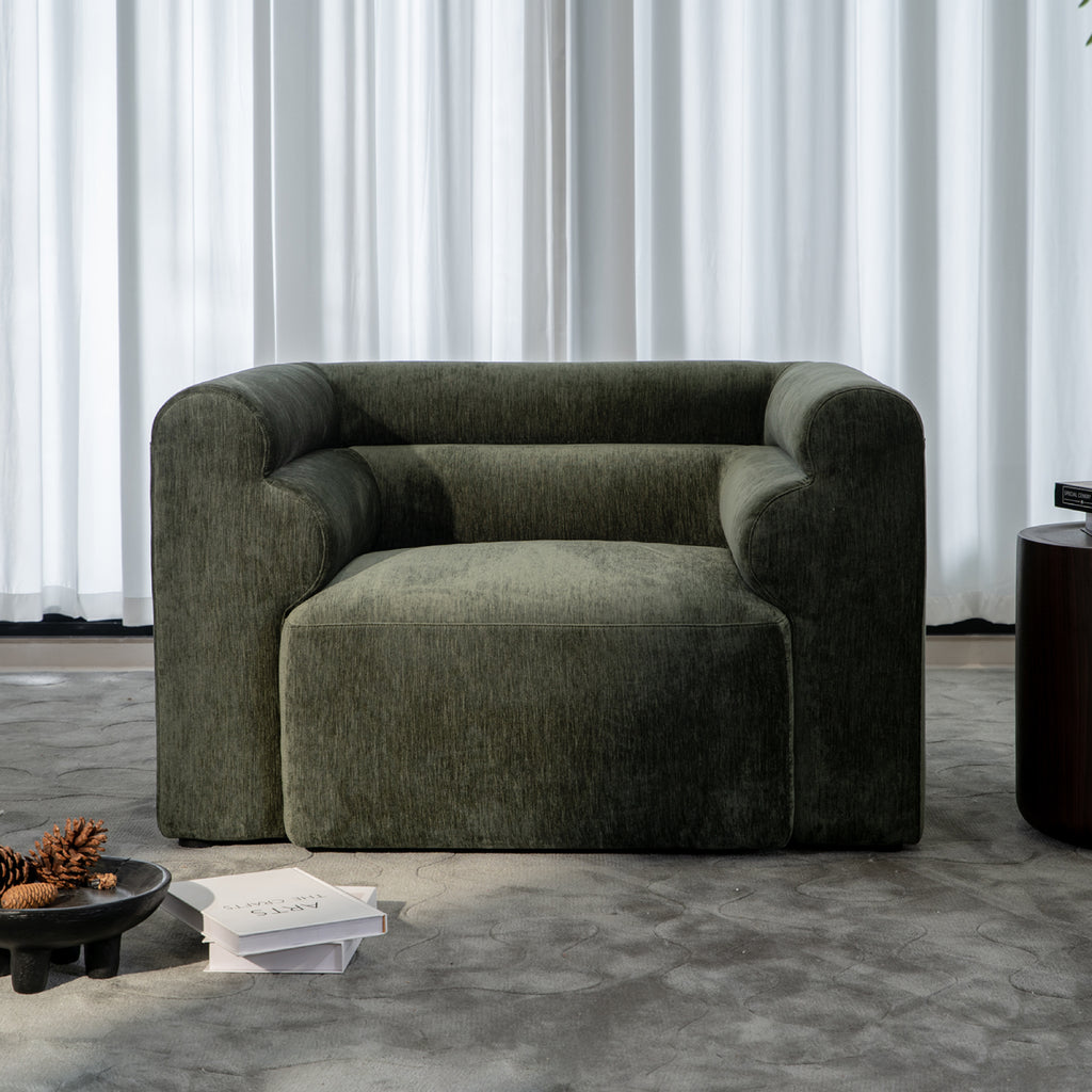 Deep-seating high-density foam single-seater sofa in premium fabric.