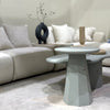 Contemporary speckled coffee tables styled together for layered look