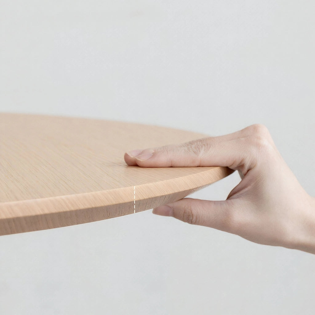 Crux-Round-Dining-Table-Oak-Stainless Steel Base Bevel Table Top Close Up