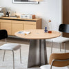 Crux-Round-Dining-Table-Oak-Stainless Steel Base Bevel Table Top Sleek Design Minimal Japandi Dining Set Up