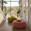 Large lounge chair in the shape of a donut.