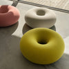 Donut-shaped lounge stool soft material and cushion.