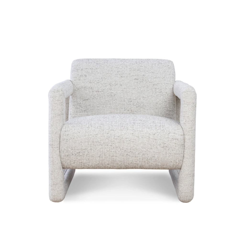 Modern armchair featuring textured white fabric upholstery and geometric armrests.