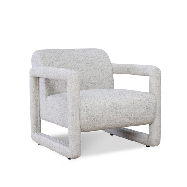 Modern armchair featuring textured white fabric upholstery and geometric  armrests.