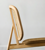 Kane Rattan Armchair wooven Rattan Backrest Minimal Curved Geometric Structure