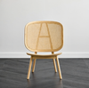 Kane Rattan Armchair wooven Rattan Backrest Minimal Curved Living Lifestyle