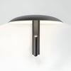 Unique wall light 360° adjustable ambient lighting in black steel for living room, bedroom, or hallways.