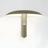 Minimal wall lamp design with 360° adjustable ambient lighting in green steel for living room, bedroom, or hallways.