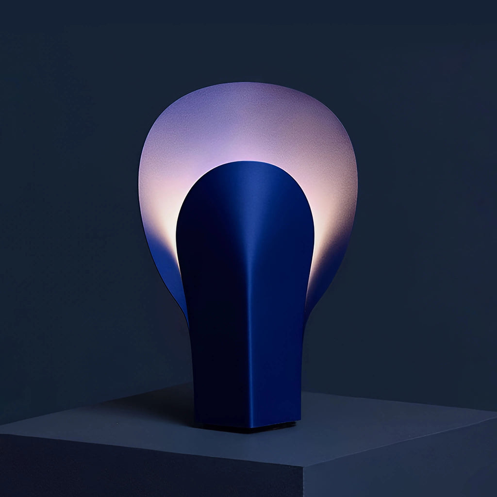 Deep blue steel table lamp, warm soft ambient light creates a moody tone.