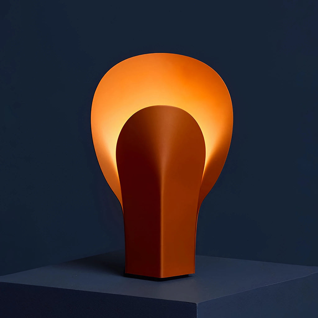 Nodo Table Lamp in terracotta orange steel, warm ambient light. Available in Malaysia.