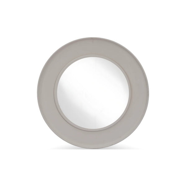 Modern round mirror with sculptural neutral-toned frame