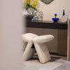 Designer stool upholsteredin boucle elegant bedroom dresser