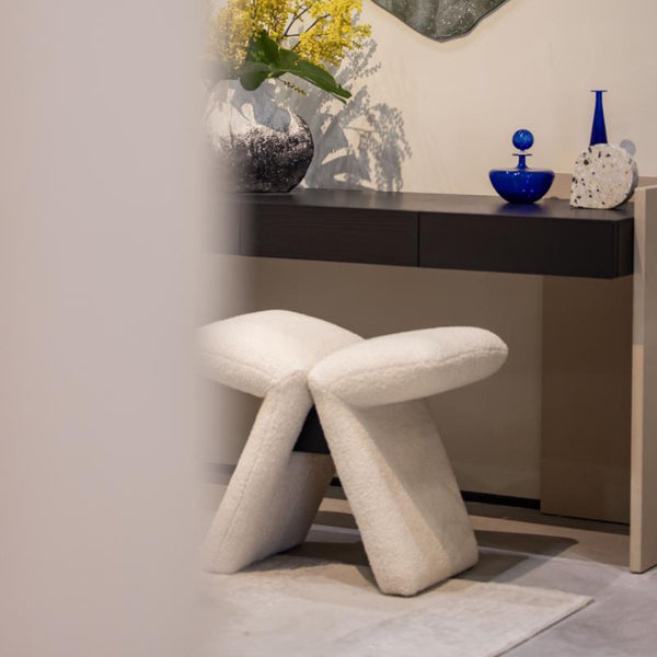 Designer stool upholsteredin boucle elegant bedroom dresser