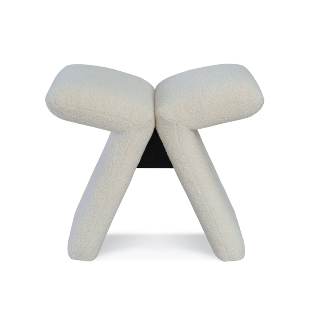 Papillon stool front view with boucle upholstery
