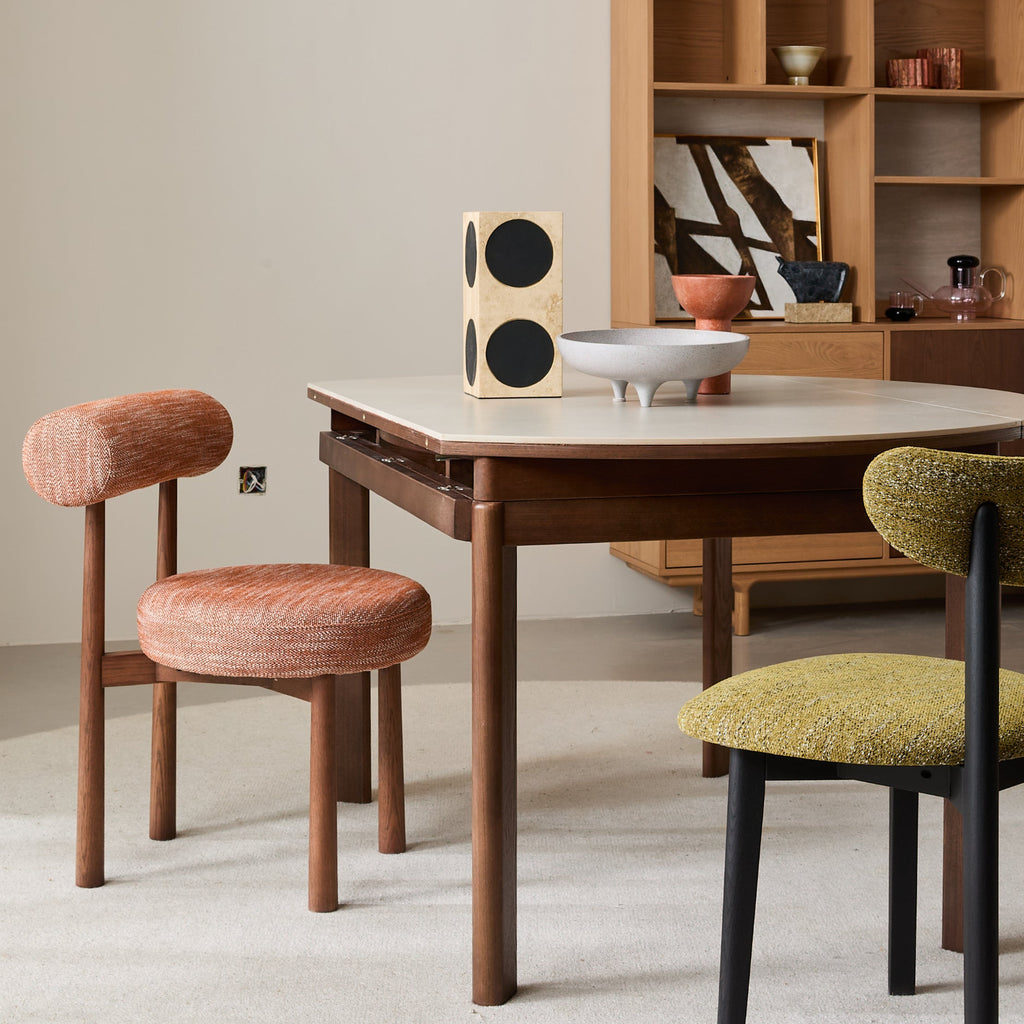 PILLO Dining Chair in cushioned backrest and seat, in warm and earthy color tones.