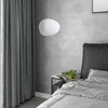Minimalist, modern and elegant pendant light in white organic pebble shape bedroom