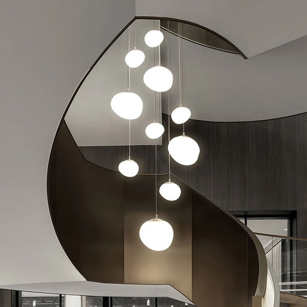 Minimalist, modern and elegant pendant lights in white pebble shapes stairway design