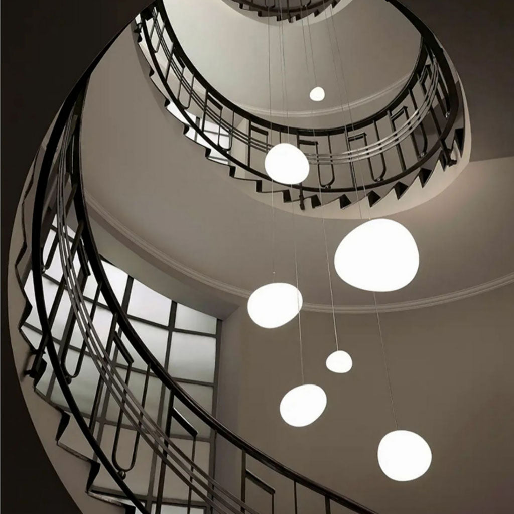 Minimalist, modern and elegant pendant light in white organic pebble shapes stairway design