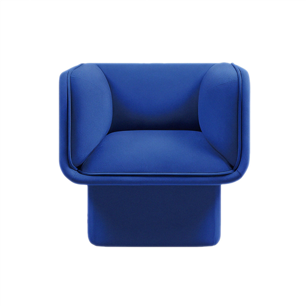 Plush blue velvet Todd sofa offering modern elegance with a sculptural touch