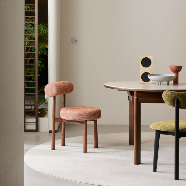 PILLO Dining Chair styled beside a modern dining table in a contemporary resort-style dining room.