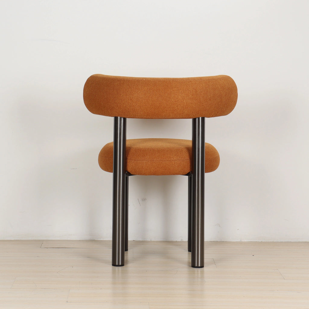 Back view of the ROLO dining chair showing linen texture and curved stitching on its backrest.