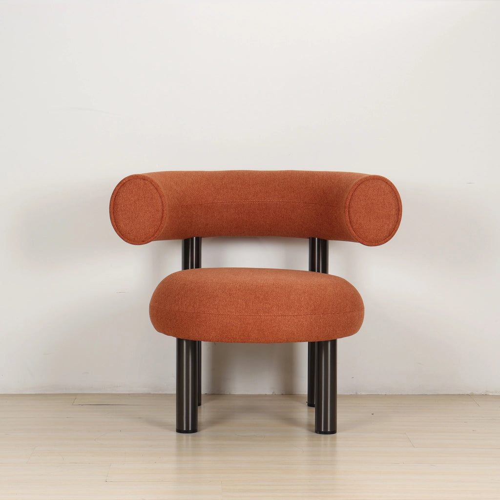 Front view of the ROLO lounge chair, wide rounded seat and wraparound backrest.