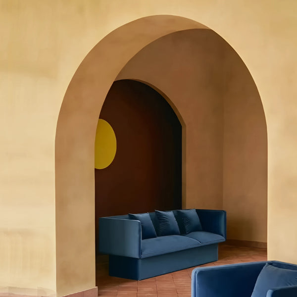 Todd blue velvet sofa blending cleanlines with a unique rounded form