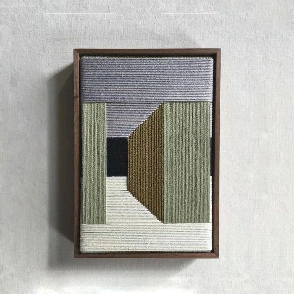 Modern fibre artwork framed in wood with colour-block design