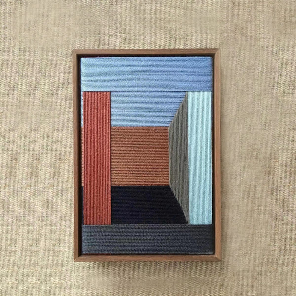 Geometric hand-woven wall art in warm and earthy tones