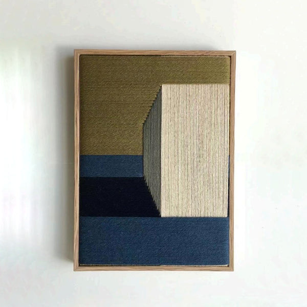 Geometric hand-woven wall art in warm and earthy tones